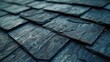 A detailed close up view of a slate roof with a shiny surface. This image can be used to showcase the beauty and craftsmanship of slate roofs.