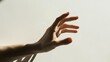 Close-up of a hand with extended fingers, catching the light, isolated white background generative ai