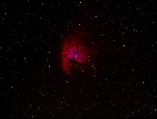 Wall Mural - a colorful red nebula in outer space