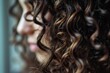 Closeup of beautiful curly hairstyle in spa salon.