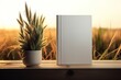 A white book on cozy wheat plantation background of mockup for graphic art. Book mockup with wheat in an inviting and serene scene in a calm and welcoming environment.