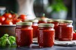 Homemade tomato sauce preserved in glass jars on the kitchen shelf