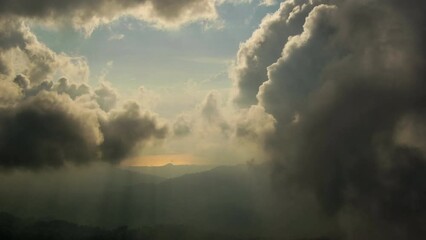 high altitude cloud filming from drone - evening light and cumulus clouds drifting away from camera 