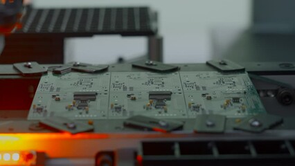 Poster - Close up of industrial background with printed circuit board being assembled with automated robotic arm. Creative. Concept of modern robotic technologies and engineering.