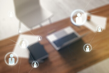 Poster - Double exposure of social network icons concept and modern desktop with laptop on background. Marketing and promotion concept