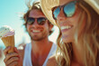 © Teeradej - Smiling couple enjoying ice cream cones.