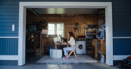 Poster - Hispanic Female Developer Programming On Old Desktop Computer In Retro Garage With Random Appliances. Young Woman Working On Innovative Online Service Startup Company In Nineties. Nostalgia Concept.