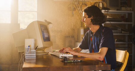 Poster - Caucasian Male Software Engineer Programming On Old Desktop Computer In Retro Garage With Random Appliances. Man Starting an Innovative Fintech Startup Company In Nineties. Nostalgia Concept.