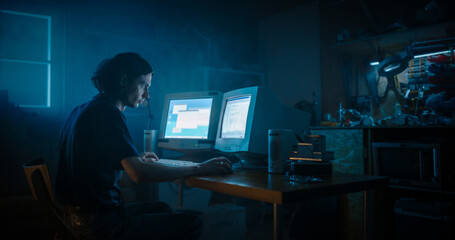 Leinwandbilder - Caucasian Male Programmer Using Old Desktop Computer With Two Monitors In Retro Garage Late At Night. White Hat Hacker Searching For Software Vulnerabilities, Coding Cyber Security System In Nineties.