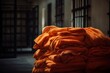 Orange robe prisoners clothes. Stack of prison detention tangerine clothing. Generate ai
