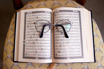 Sticker - Arabic open Quran with glasses.  France.