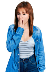 Wall Mural - Redhead young woman wearing casual denim jacket bored yawning tired covering mouth with hand. restless and sleepiness.