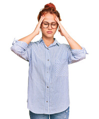 Canvas Print - Young redhead woman wearing casual clothes and glasses suffering from headache desperate and stressed because pain and migraine. hands on head.