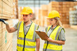 © chokniti - Professional Engineer, carpenter or worker team are checking and inspecting hardwood, timber or wooden pallet material for furniture production. Technician is wearing a hardhat while monitoring stock.