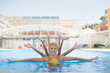 © Fotografia Juan Reig - Group of eight teenage synchronized swimmers in a swimming pool. Synchronized swimming team performing a synchronized routine of elaborate movements in the water.