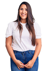 Sticker - Young beautiful brunette woman wearing casual t-shirt looking positive and happy standing and smiling with a confident smile showing teeth