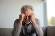 © Irene - Senior man suffering a panic attack alone. Feeling fear and stress, mental health concept