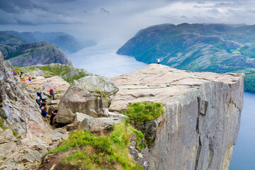 Wall Mural - Preikestolen and surrounding area, Norway. Lysefjorden below. Unrecognizable people.