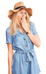 Sticker - Young beautiful blonde woman wearing summer hat and dress bored yawning tired covering mouth with hand. restless and sleepiness.