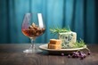 whole aged stilton cheese with port wine in a glass