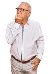 Sticker - Senior caucasian man wearing business shirt and glasses looking stressed and nervous with hands on mouth biting nails. anxiety problem.