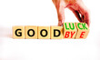 © Dzmitry - Good luck or goodbye symbol. Concept words Good luck or Goodbye on beautiful wooden blocks. Beautiful white background. Businessman hand. Business, motivational good luck concept. Copy space.