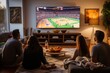 A group of friends sits, watching basketball on TV, snacks around. The living room is full of people watching a basketball game on TV. 