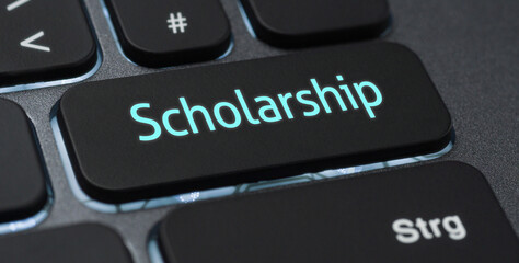 Wall Mural - illuminated keyboard with a labeled key - scholarship