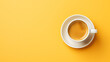 Top view cup of coffee latte on yellow background