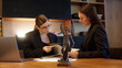© Vladislav - A female lawyer at her workplace communicates with a young client, discussing issues of legal significance. Consultation concept with legal and financial issues