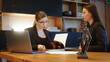 © Vladislav - A female lawyer at her workplace communicates with a young client, discussing issues of legal significance. Consultation concept with legal and financial issues