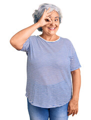 Sticker - Senior woman with gray hair wearing casual striped clothes doing ok gesture with hand smiling, eye looking through fingers with happy face.