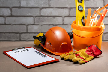 Wall Mural - Safety equipment, tools and check-list with text SAFETY FIRST. safety first, construction concept.