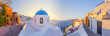 © Travel 'n' Lifestyle - View of Oia at sunset, a small town with whitewashed houses on Santorini Island, Cyclades islands archipelagos, Aegean Sea, Greece.