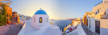 View Of Oia At Sunset, A Small Town With Whitewashed Houses On Santorini Island, Cyclades Islands Archipelagos, Aegean Sea, Greece.
