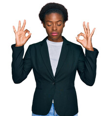 Poster - Young african american girl wearing business clothes relaxed and smiling with eyes closed doing meditation gesture with fingers. yoga concept.