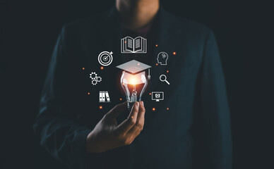 Leinwandbilder - Education technology, e-learning, internet lessons, online webinars are attended by a person, businessman hold lightbulb with education icon set, innovation, study online, ideas form learning.