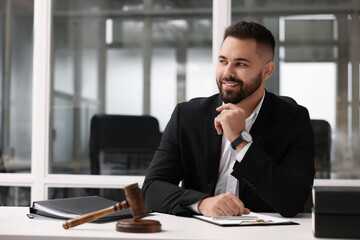 Poster - Portrait of smiling lawyer at table in office