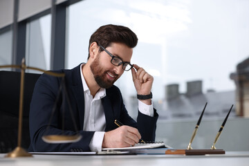 Sticker - Smiling lawyer working at table in office, space for text