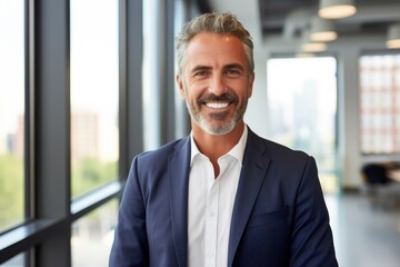 Wall Mural - Middle aged businessman of caucasian ethnicity in a modern office in new york portrait smiling ,copy space , smiling , bright , natural light 