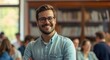 © olegganko - a smiling man in glasses standing in front of class