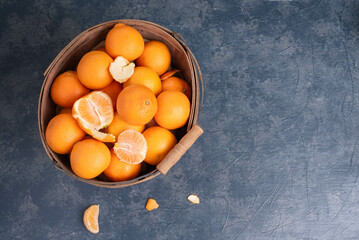 Wall Mural - Basket filled with mandarin oranges.