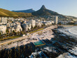 © Amazing Aerial - Aerial view of Milton tidal pool a popular swimming spot on the Sea Point Promenade with Lions Head mountain behind, Cape Town, South Africa.