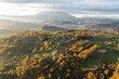 © AmazingAerialAgency - Aerial view of a mountains and hills landscape with vineyard and countryside houses at sunset in autumn colours, Irpinia, Avellino, Campania, Italy.