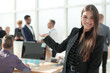 © ASDF - smiling friendly business woman on the background of the office.
