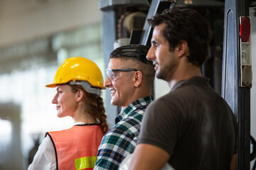 Group of industrial or engineer team corporate workers standing line up and looking forward, industry manufacturing factory people working with visions. Successful business and teamwork