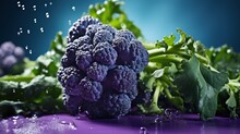  A Close Up Of A Bunch Of Broccoli On A Purple Surface With Water Splashing On The Broccoli.