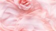  a close up of a pink flower on a bed of white fabric with a pink rose in the center of the photo.