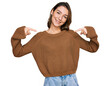© Krakenimages.com - Young caucasian girl wearing casual clothes looking confident with smile on face, pointing oneself with fingers proud and happy.