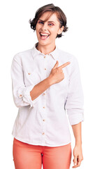 Sticker - Beautiful young woman with short hair wearing elegant white shirt cheerful with a smile of face pointing with hand and finger up to the side with happy and natural expression on face